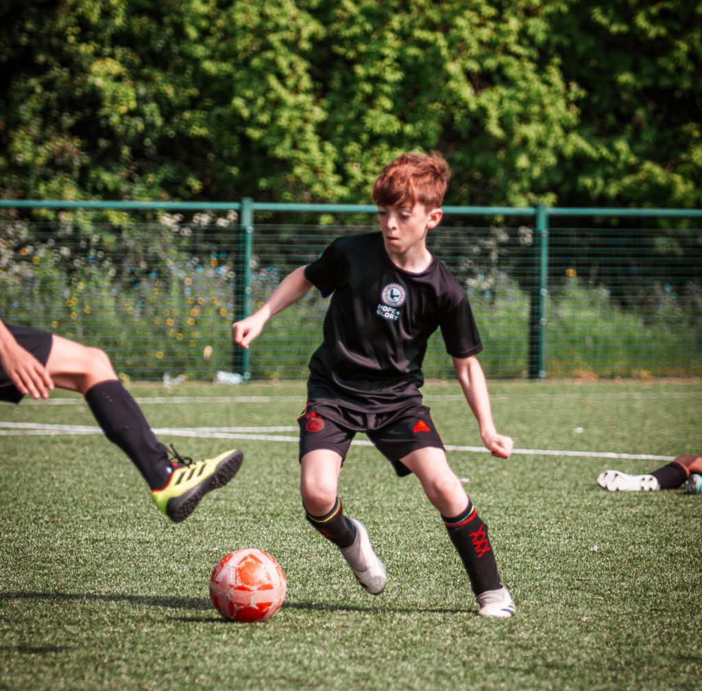 Boy playing football