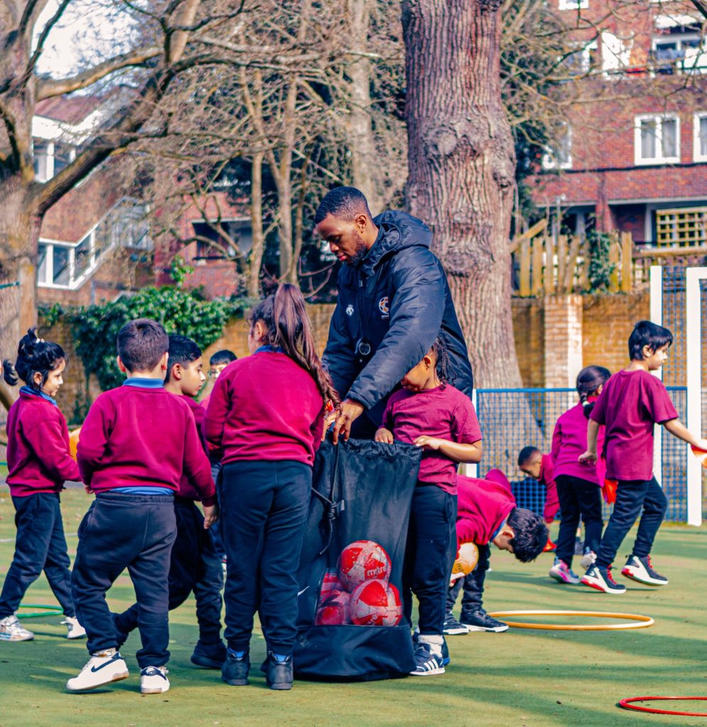 PE Teacher with children